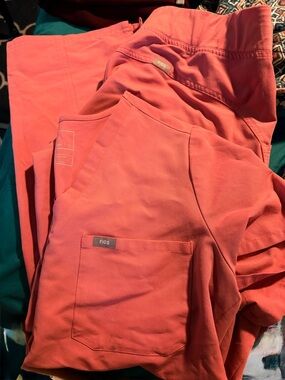 FIGS Coral Pink Technical Scrub Top. Size M bottom. Size Lg top